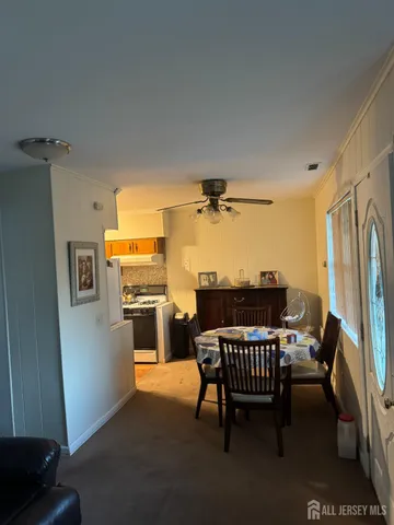 a living room with furniture and a lamp