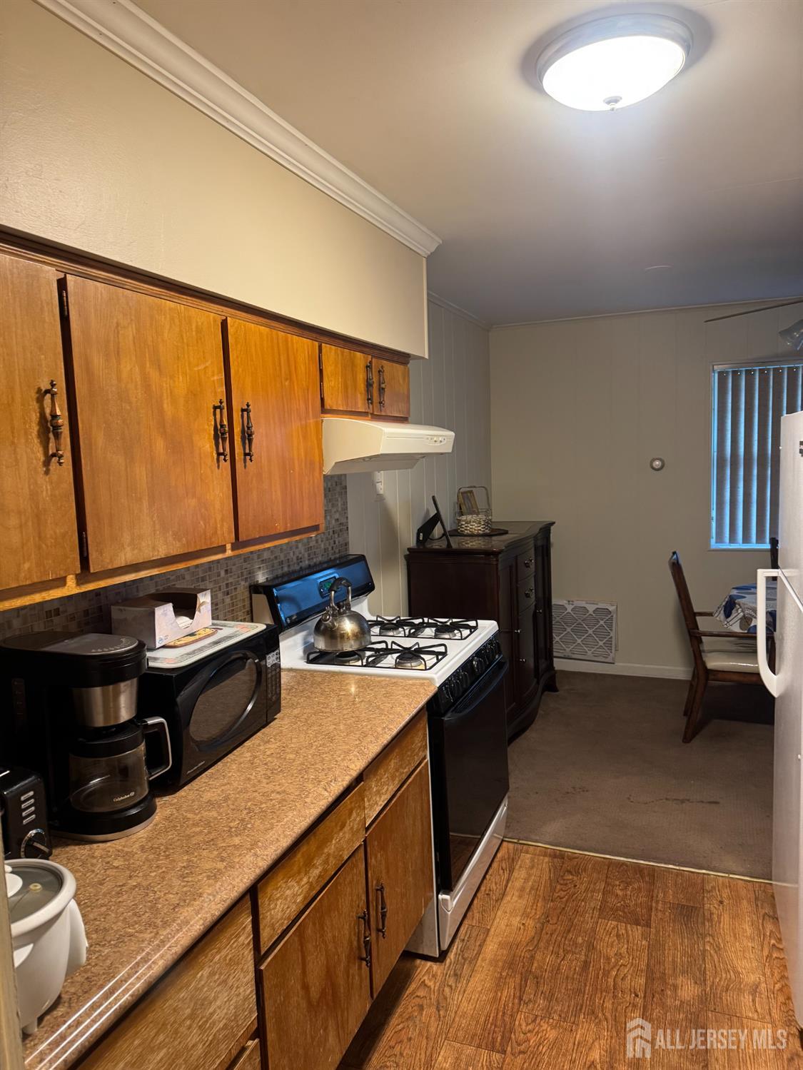 9 Valery Road Old Bridge, NJ 07747 - Photo 5 of 7 a kitchen with a stove and a sink