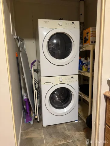 a kitchen with stainless steel appliances granite countertop a refrigerator stove and sink