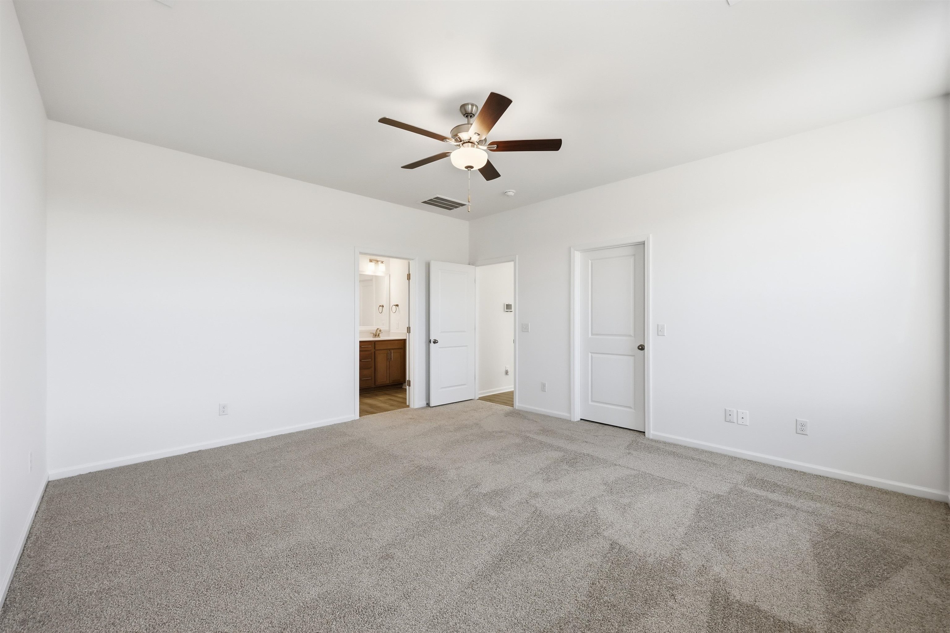 145 River Birch Drive Loris, SC 29569 - Photo 11 of 36 Unfurnished bedroom with ceiling fan, carpet flooring, and ensuite bath