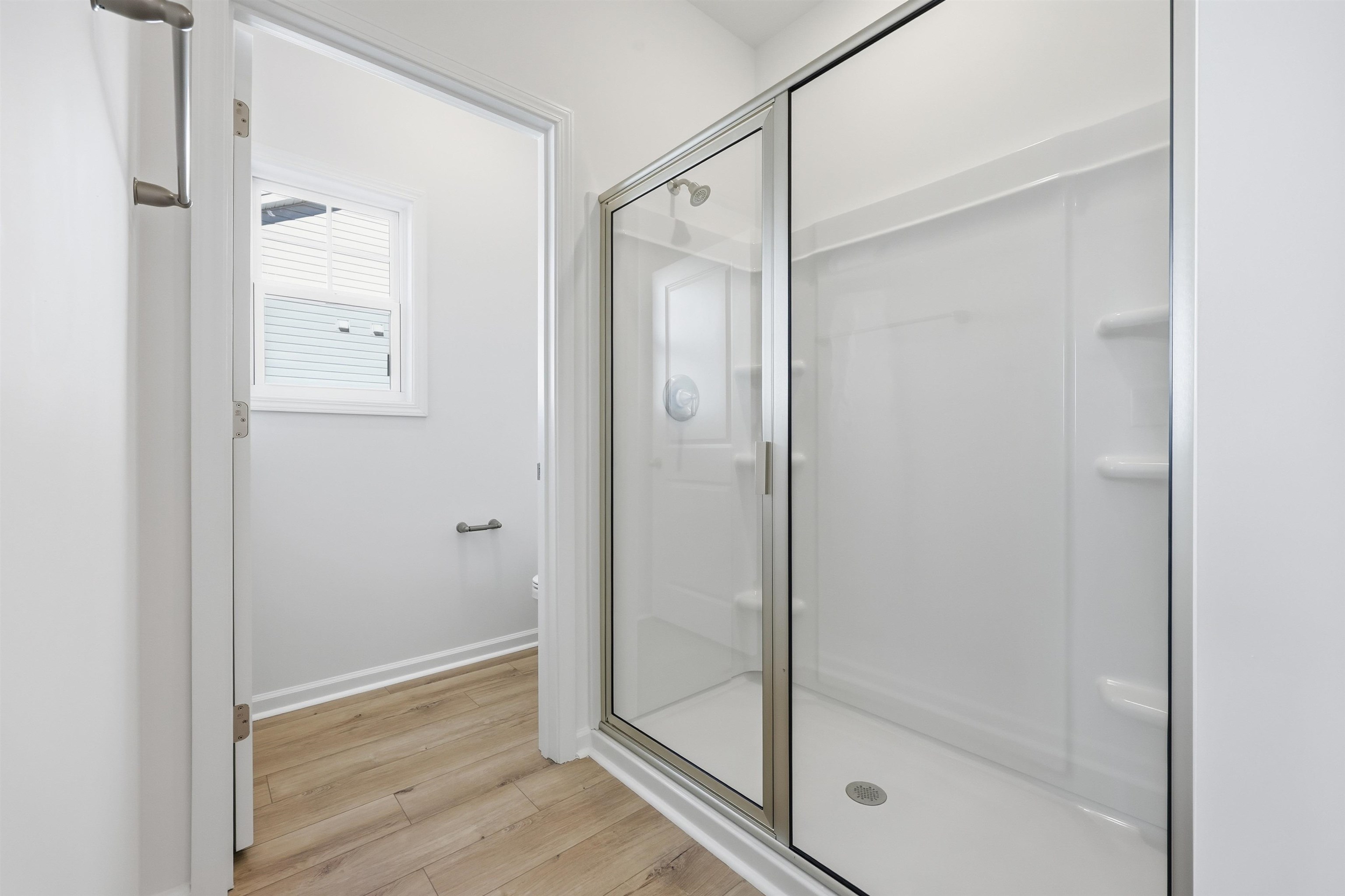 145 River Birch Drive Loris, SC 29569 - Photo 14 of 36 Full bathroom featuring light wood-style flooring and a stall shower