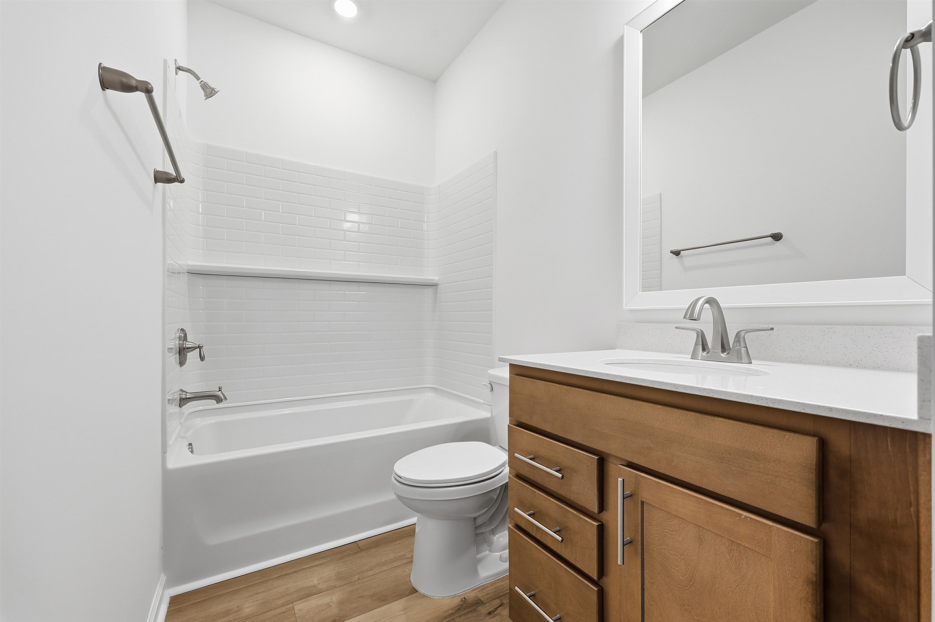 145 River Birch Drive Loris, SC 29569 - Photo 20 of 36 Full bathroom featuring vanity, shower / tub combination, and light wood-type flooring