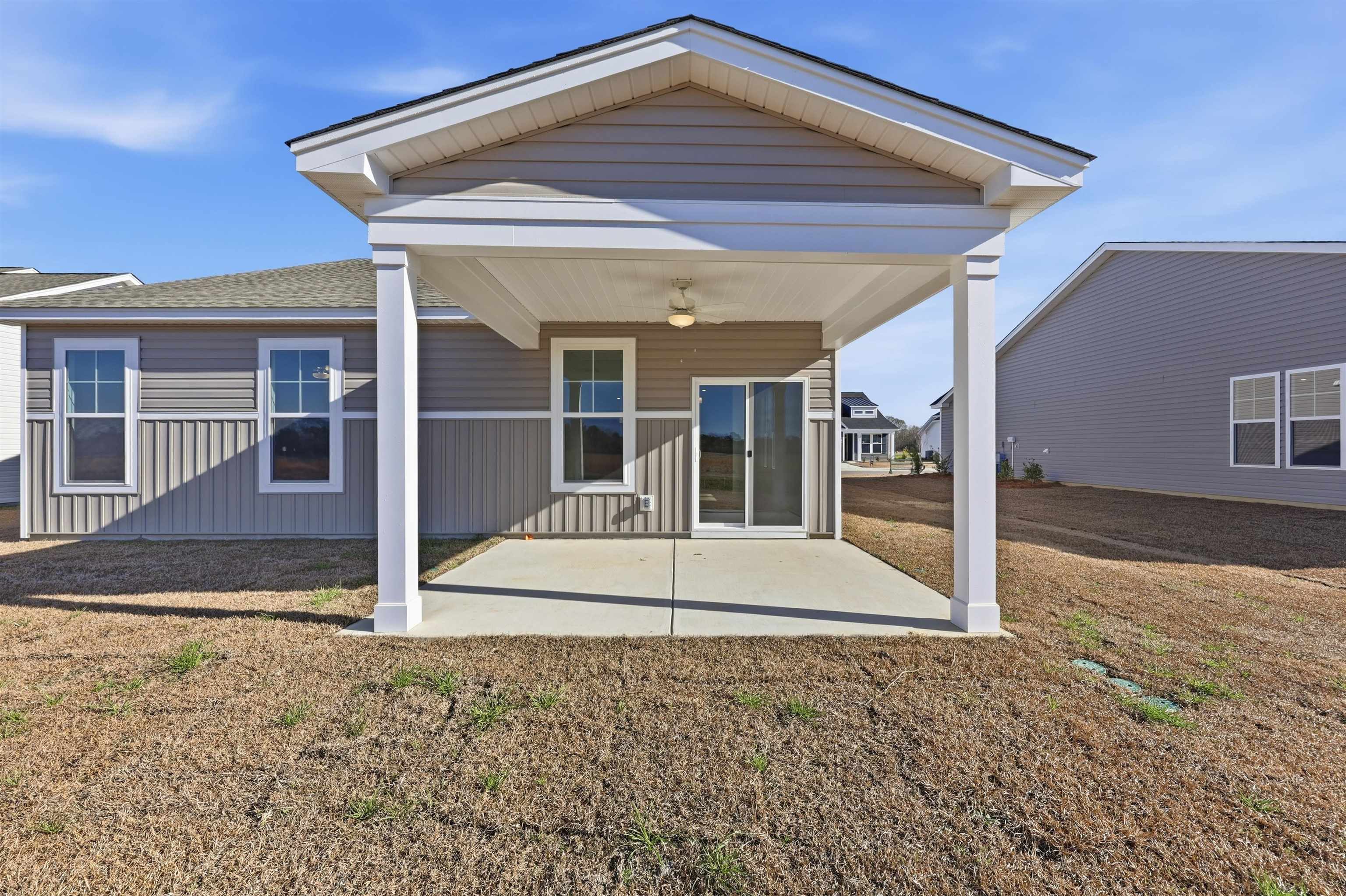 145 River Birch Drive Loris, SC 29569 - Photo 22 of 36 Back of house with a patio