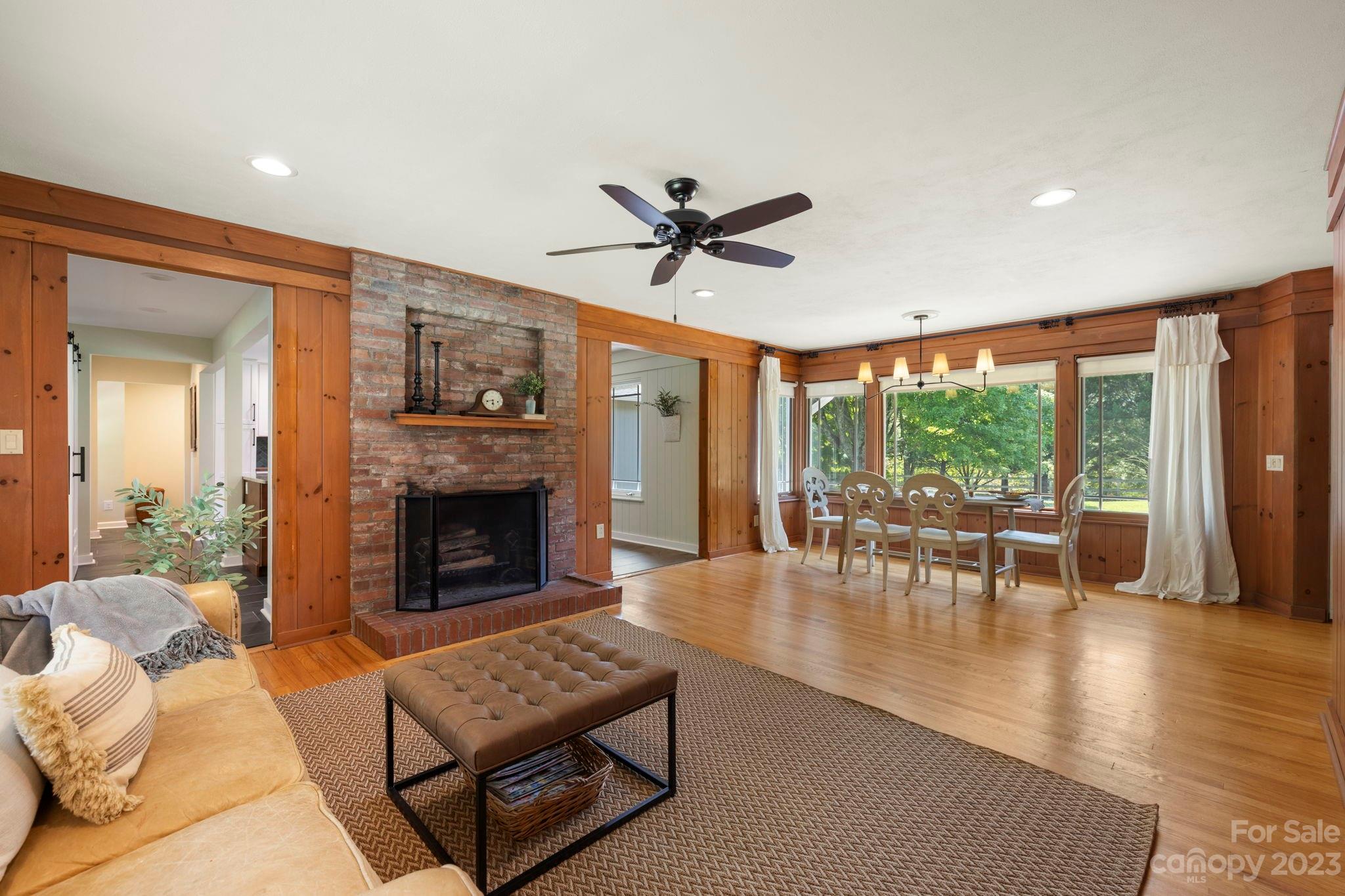 244 Mimosa Road Tryon, NC 28782 - Photo 11 of 47 a living room with furniture and a fireplace