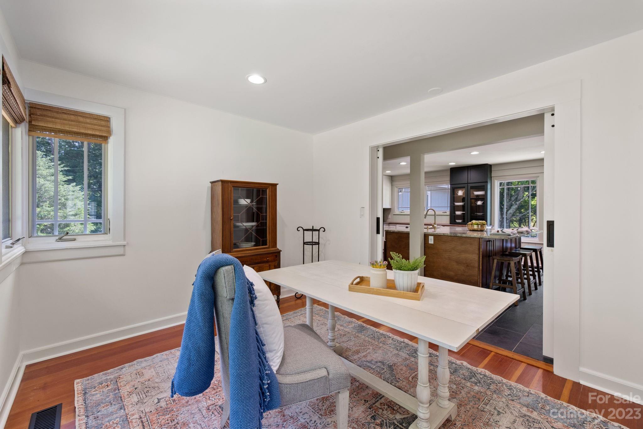 244 Mimosa Road Tryon, NC 28782 - Photo 23 of 47 a view of a dining room with furniture