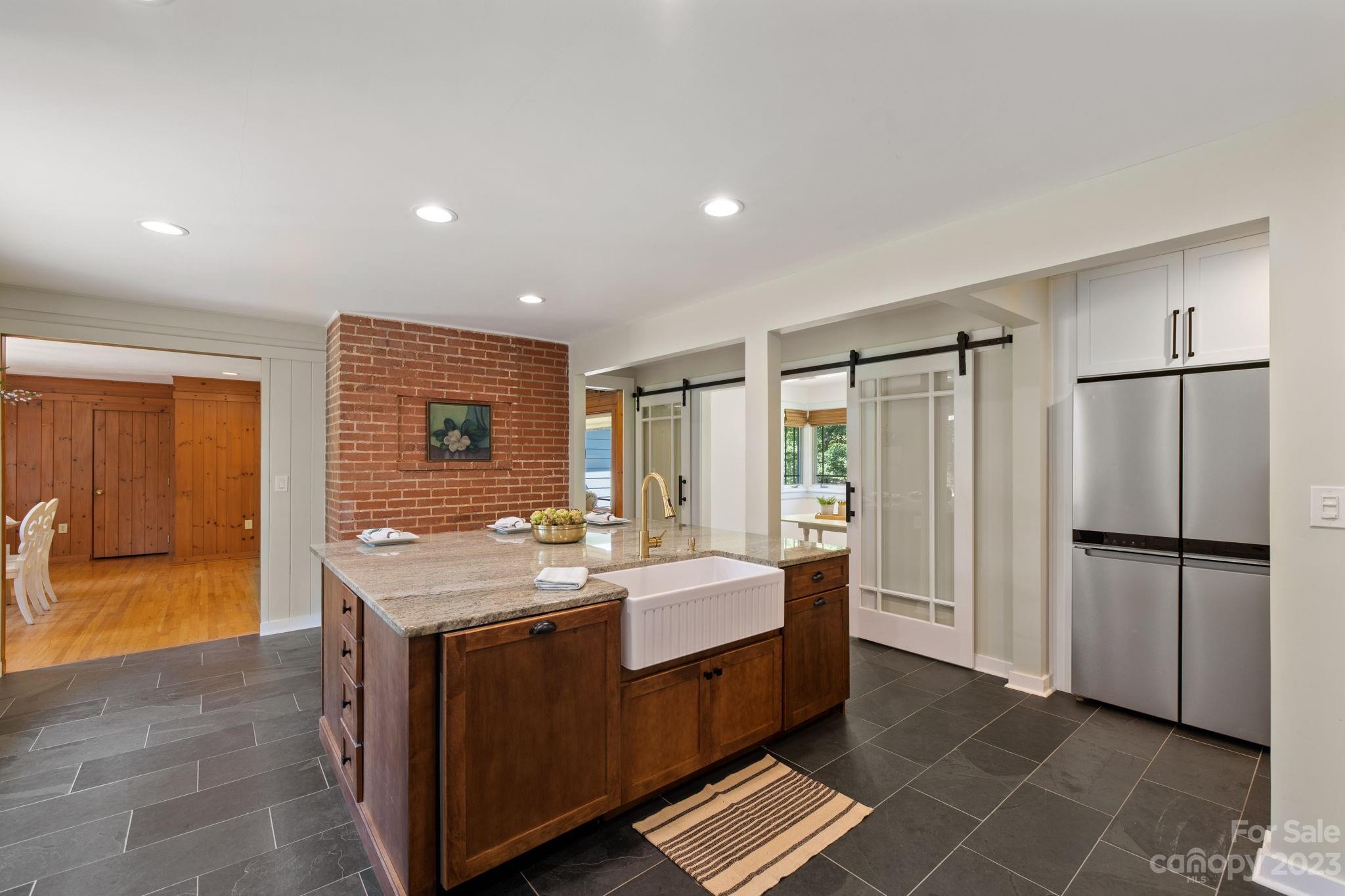 244 Mimosa Road Tryon, NC 28782 - Photo 5 of 47 a spacious bathroom with a granite countertop sink mirror and shower