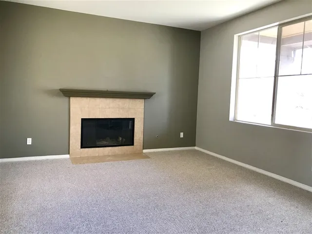 an empty room with a fireplace