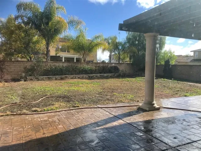 a view of a swimming pool with a patio