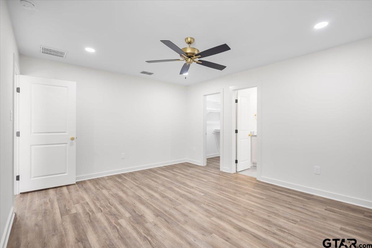 435 West Harmony Street Tyler, TX 75702 - Photo 12 of 22 wooden floor in an empty room