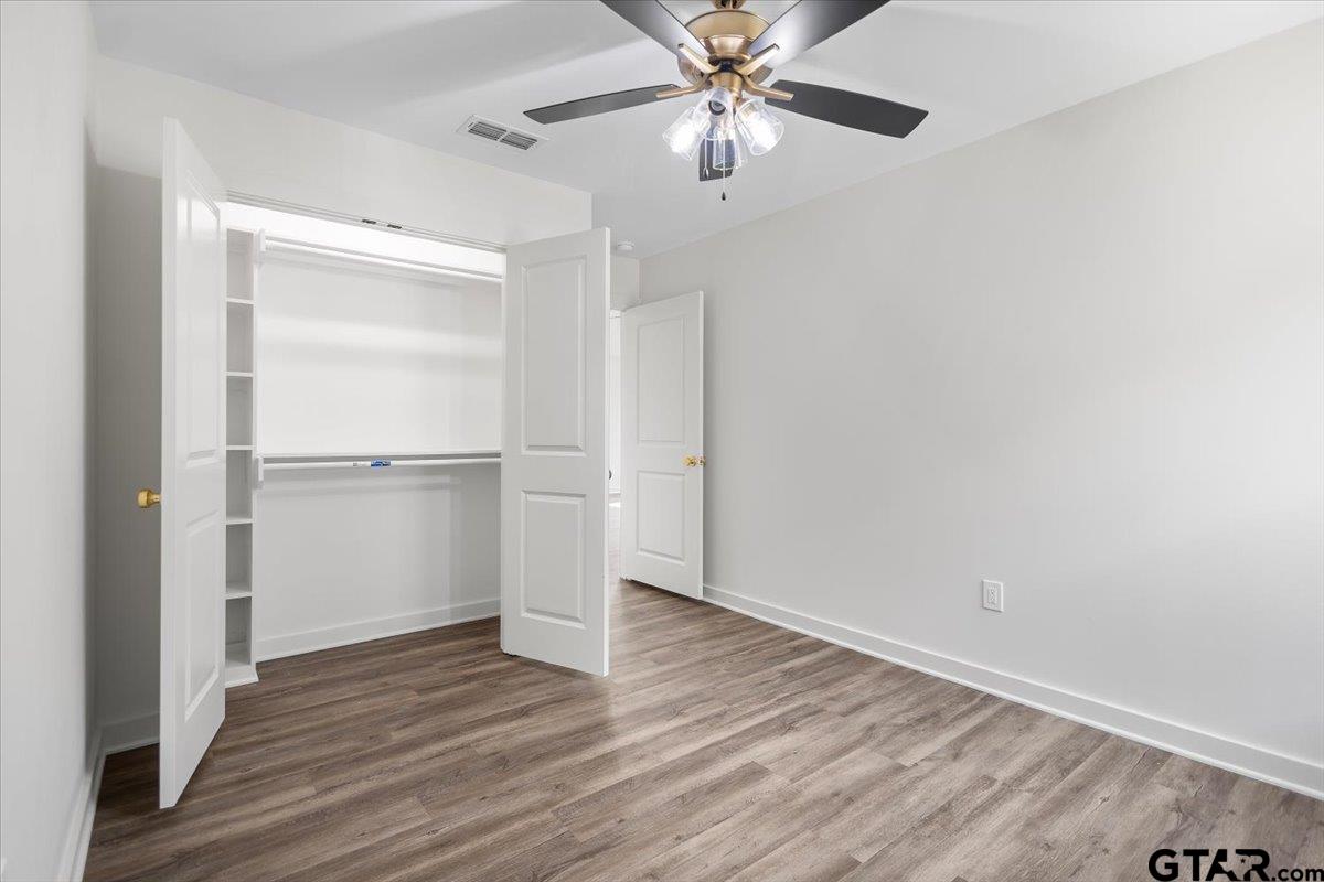 435 West Harmony Street Tyler, TX 75702 - Photo 19 of 22 a view of an empty room with wooden floor