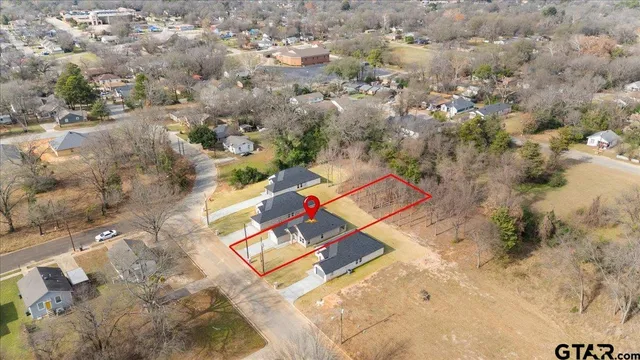 an aerial view of residential house with outdoor space