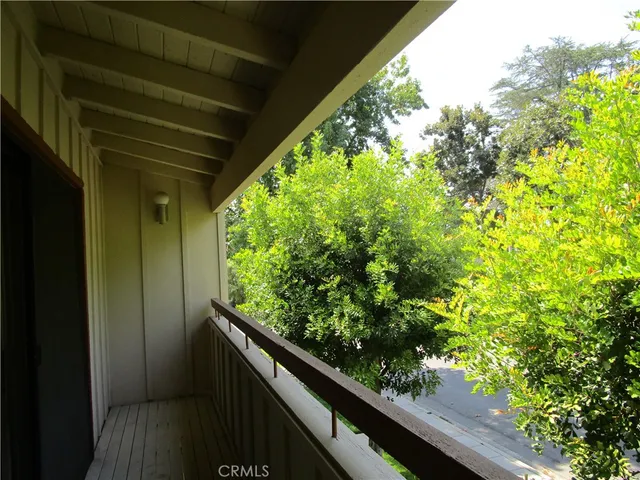 a view of a garden from a balcony
