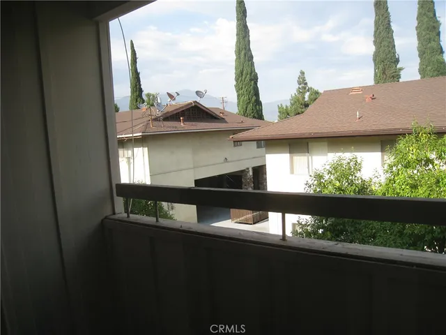 a view of a balcony with two chairs