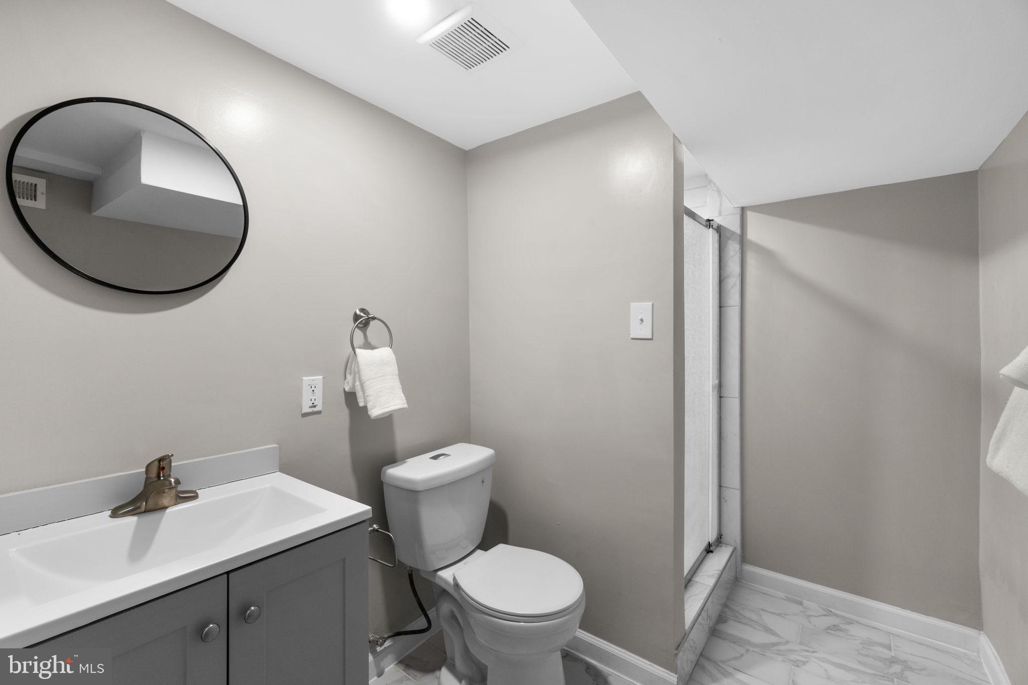 1827 Bank Street Baltimore, MD 21231 - Photo 26 of 31 Sleek modern bathroom with elegant finishes.