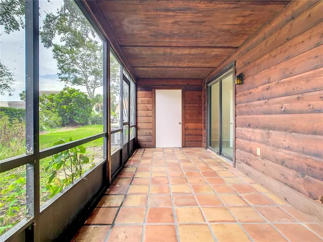 a view of a porch with wooden floor and outdoor space