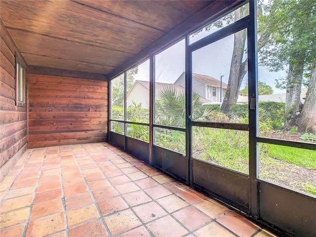 a view of empty room with windows
