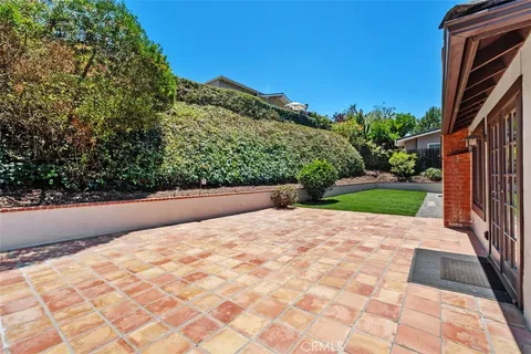 a backyard of a house with lots of green space