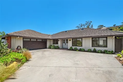 front view of a house with a small yard