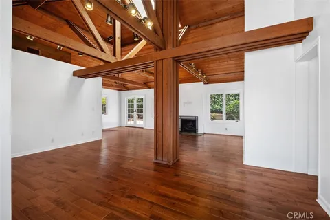 a view of a room with wooden floor and walls