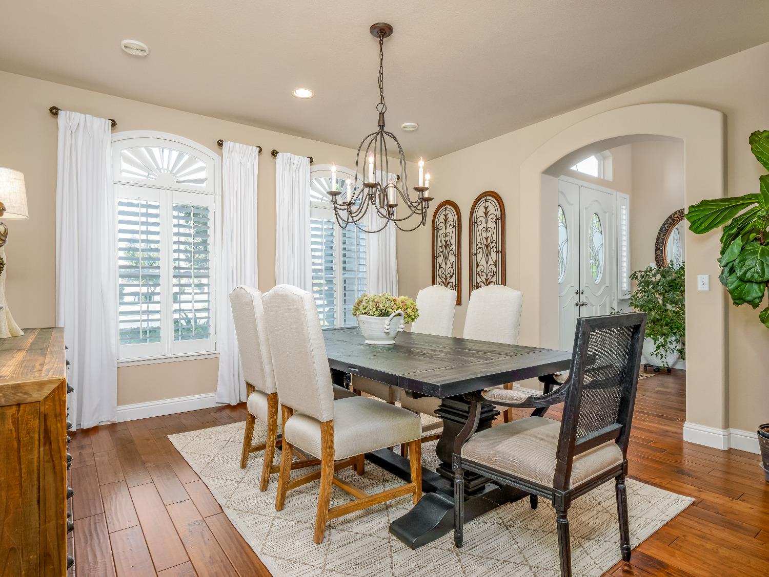 12 Breeze Way Madera, CA 93637 - Photo 16 of 48 a view of a dining room with furniture window and wooden floor