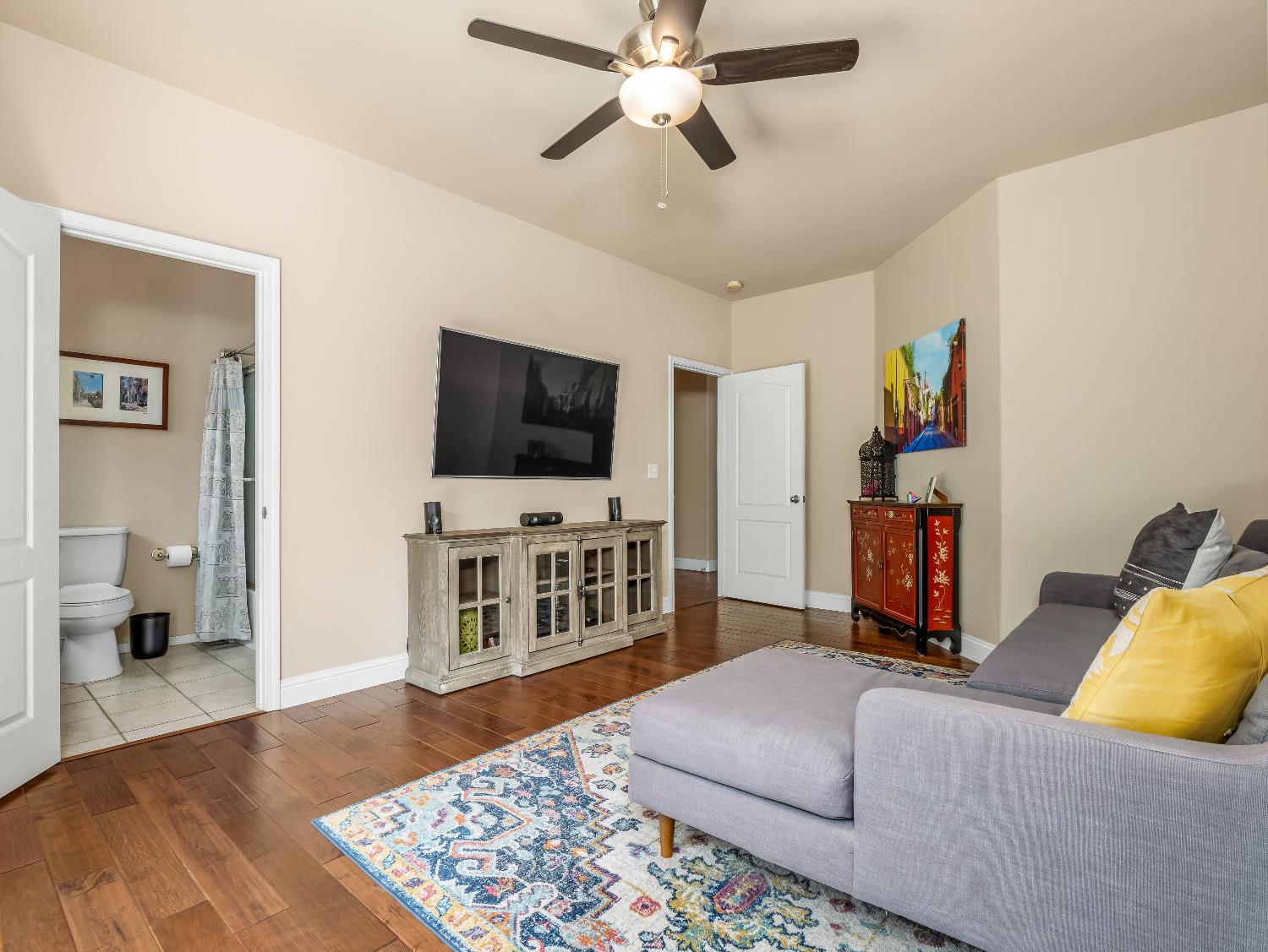 12 Breeze Way Madera, CA 93637 - Photo 19 of 48 a living room with furniture and a flat screen tv