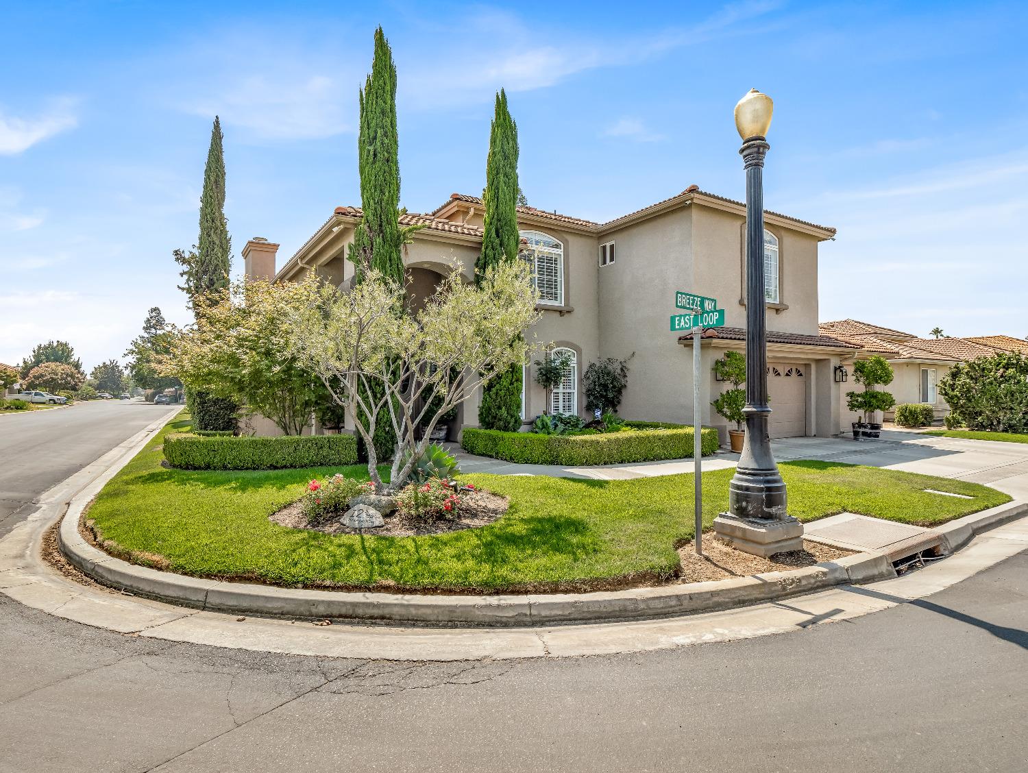 12 Breeze Way Madera, CA 93637 - Photo 2 of 48 a view of a house with a yard and plants