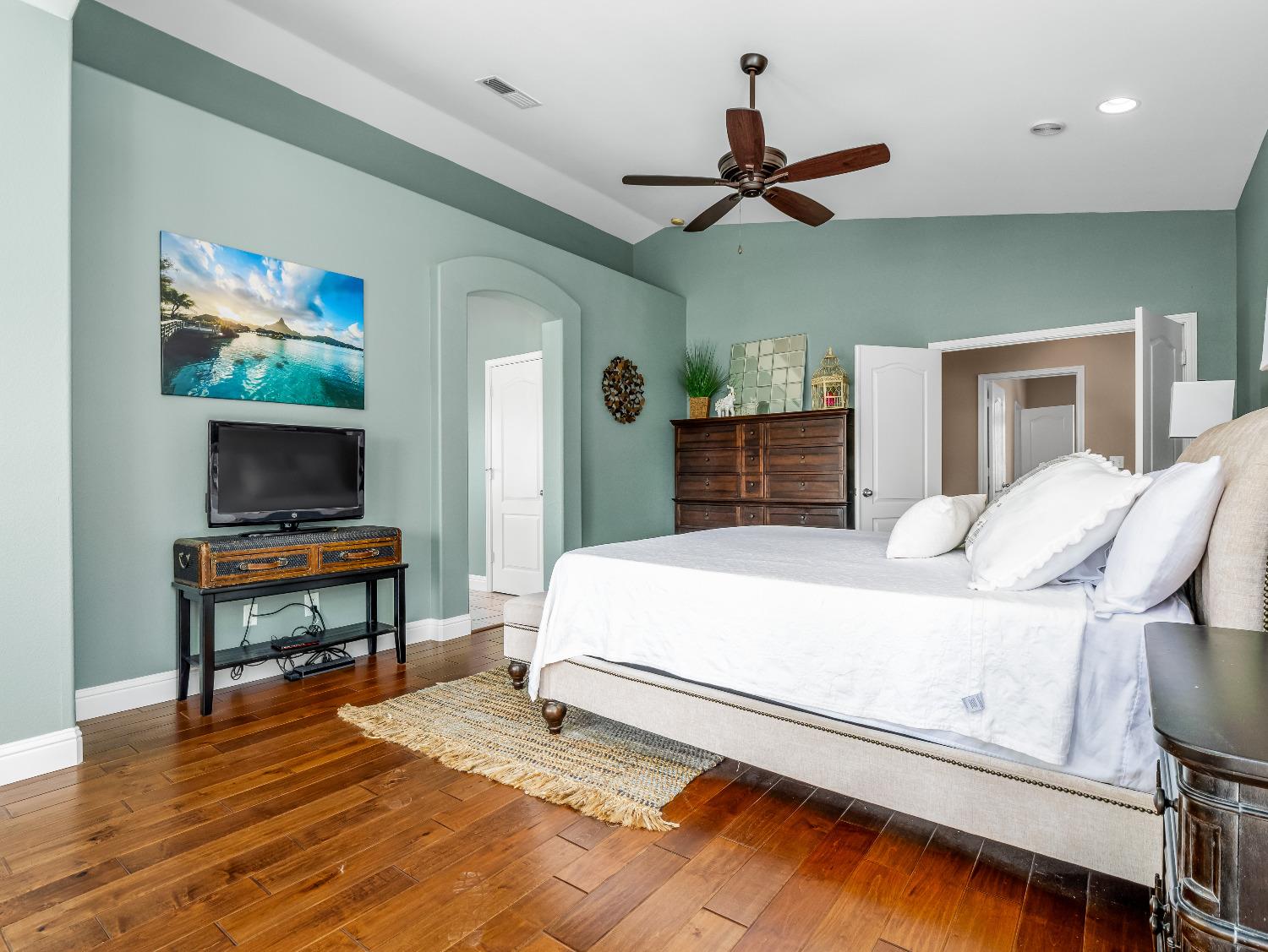 12 Breeze Way Madera, CA 93637 - Photo 24 of 48 a bedroom with a bed and a flat screen tv