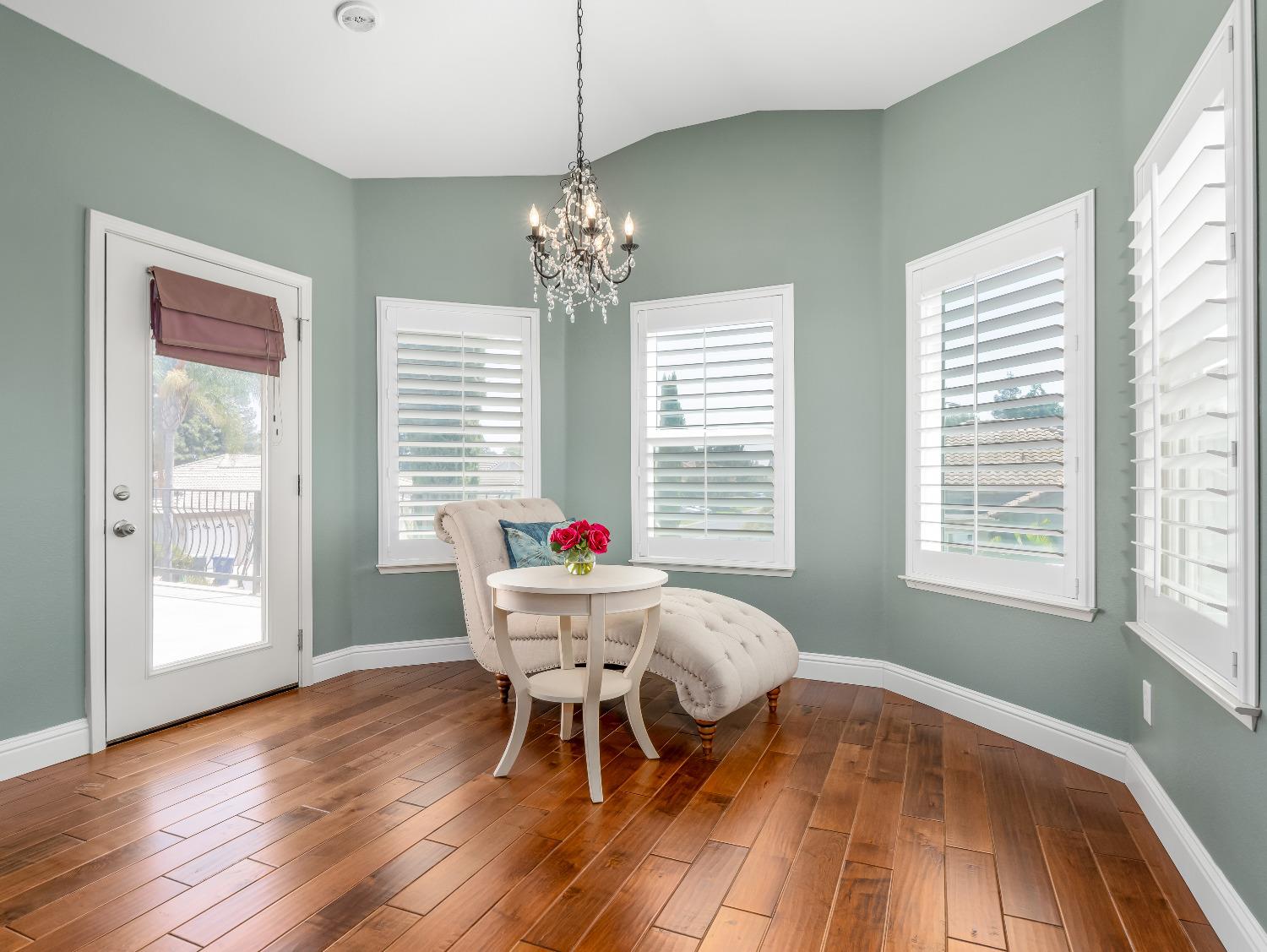 12 Breeze Way Madera, CA 93637 - Photo 25 of 48 a view of a dining room with furniture a chandelier and wooden floor