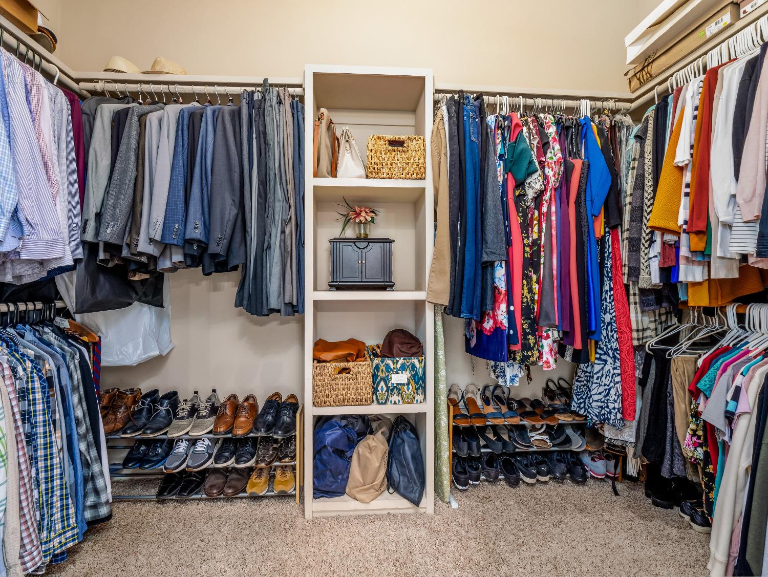 12 Breeze Way Madera, CA 93637 - Photo 30 of 48 a view of walk in closet with clothes and shoes