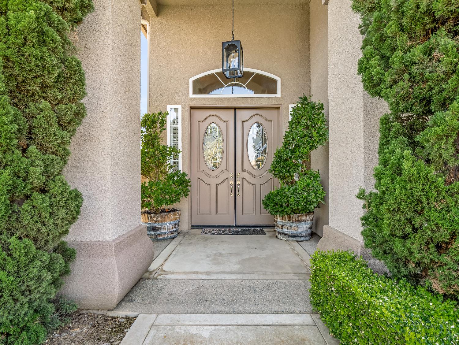 12 Breeze Way Madera, CA 93637 - Photo 3 of 48 a front view of a house with a garden