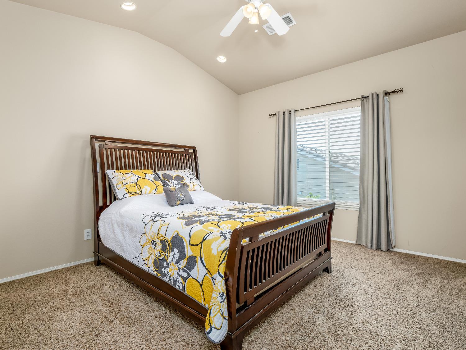12 Breeze Way Madera, CA 93637 - Photo 34 of 48 a bedroom with a bed and window