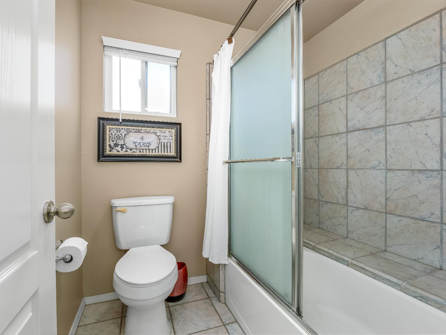 12 Breeze Way Madera, CA 93637 - Photo 37 of 48 a bathroom with a toilet and a shower