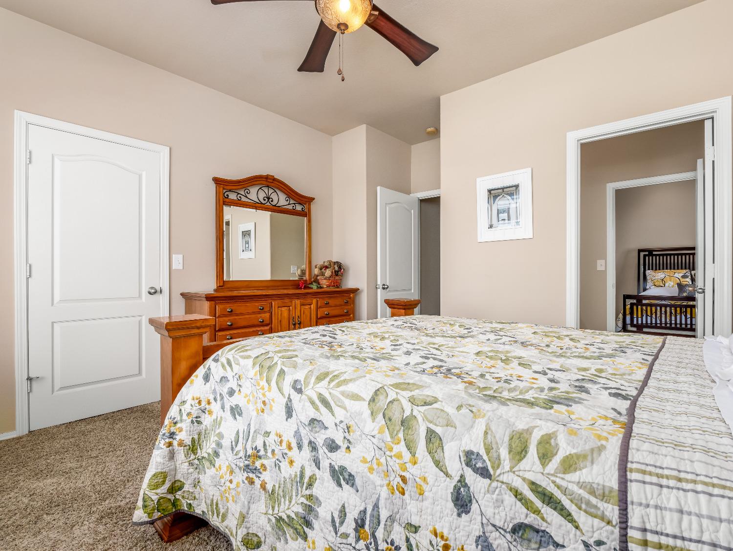 12 Breeze Way Madera, CA 93637 - Photo 39 of 48 a bedroom with a bed and a dresser