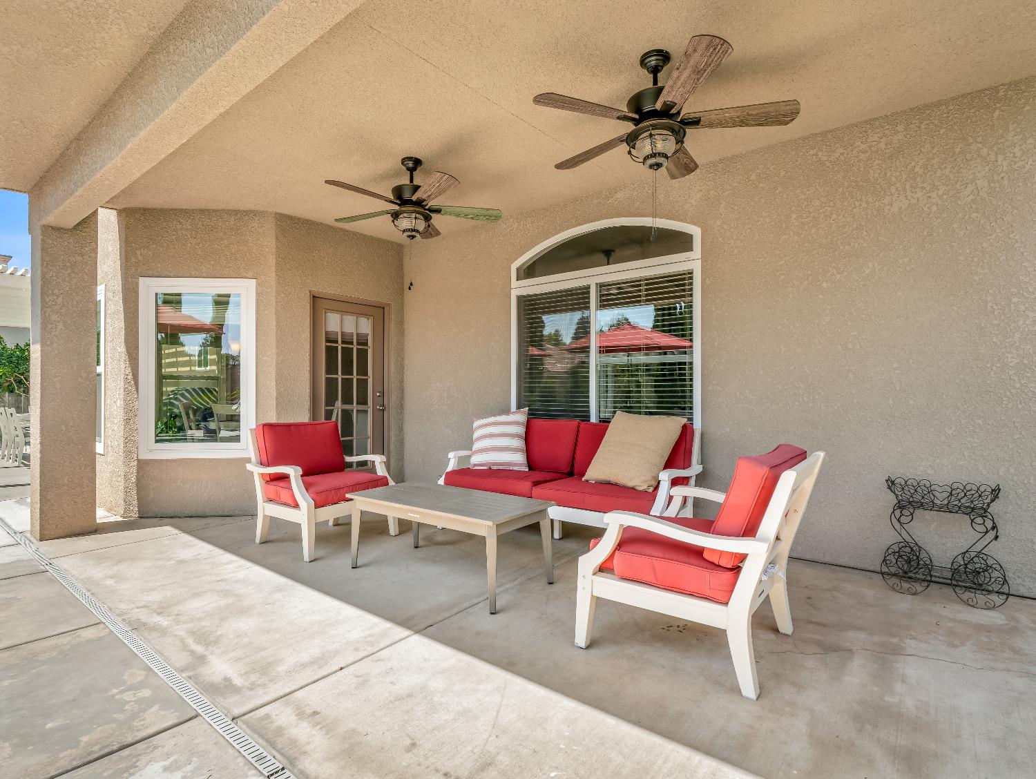 12 Breeze Way Madera, CA 93637 - Photo 44 of 48 a living room with patio chairs and a window