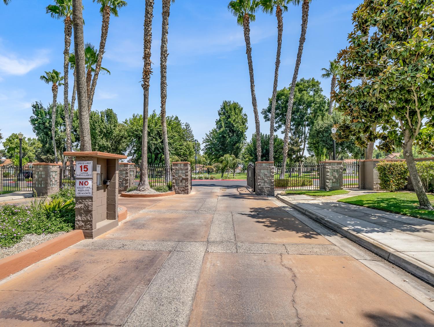 12 Breeze Way Madera, CA 93637 - Photo 47 of 48 a view of a house with palm trees and a small yard