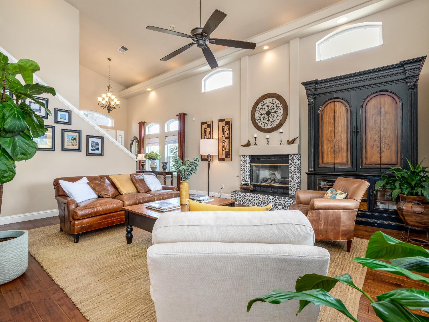 12 Breeze Way Madera, CA 93637 - Photo 7 of 48 a living room with furniture a clock and a fireplace