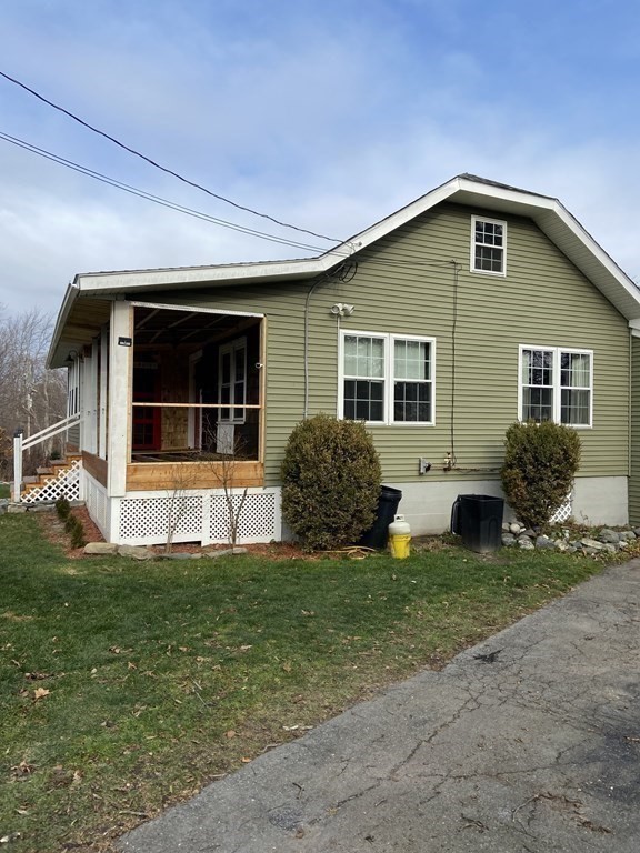 61 Schumacher Road Lancaster, MA 01523 - Photo 23 of 25 a front view of a house with a yard