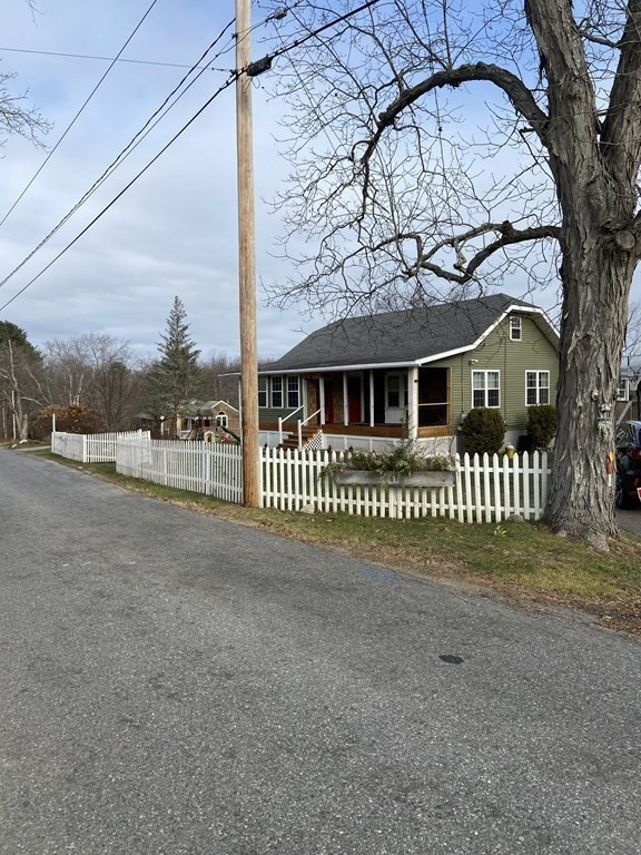 61 Schumacher Road Lancaster, MA 01523 - Photo 25 of 25 a front view of a house with a garden