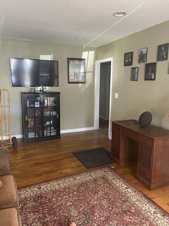 61 Schumacher Road Lancaster, MA 01523 - Photo 5 of 25 a living room with furniture and a flat screen tv