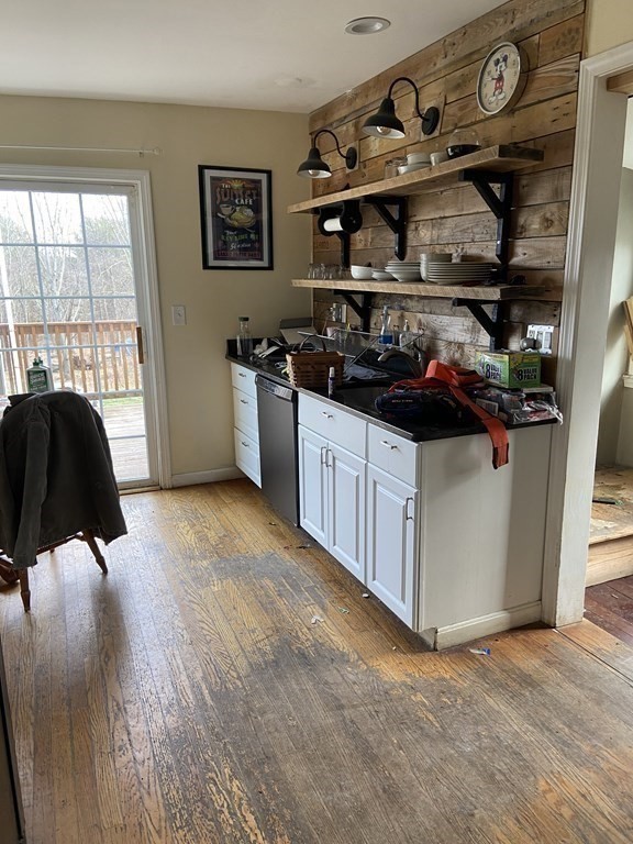 61 Schumacher Road Lancaster, MA 01523 - Photo 8 of 25 a kitchen with stainless steel appliances a stove a sink and cabinets