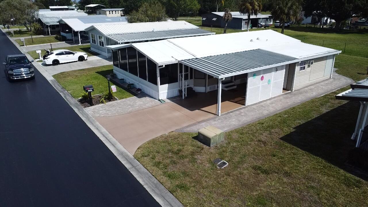 1747 Southwest 35th Circle Okeechobee, FL 34974 - Photo 2 of 21 an aerial view of a house with swimming pool