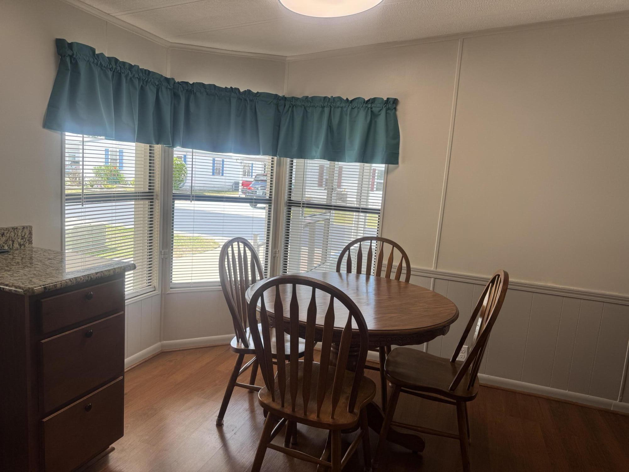 1747 Southwest 35th Circle Okeechobee, FL 34974 - Photo 10 of 21 a dining room with furniture and window