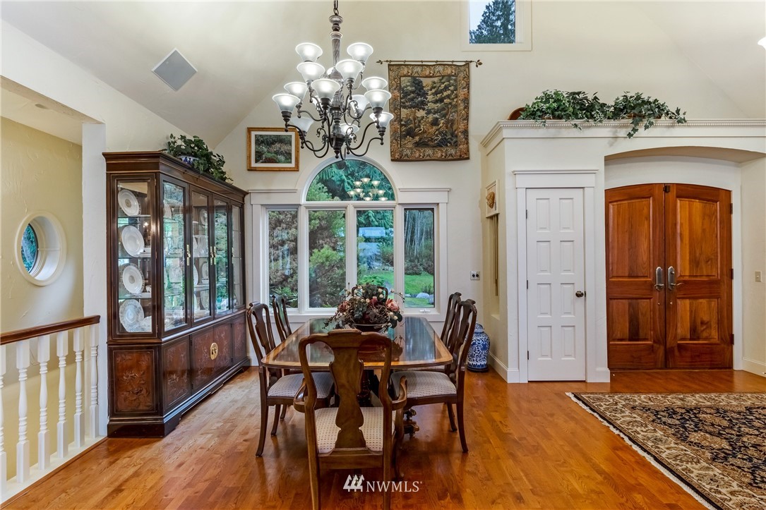 764 Big Foot Road Friday Harbor, WA 98250 - Photo 11 of 34 a view of a dining room with furniture window and wooden floor