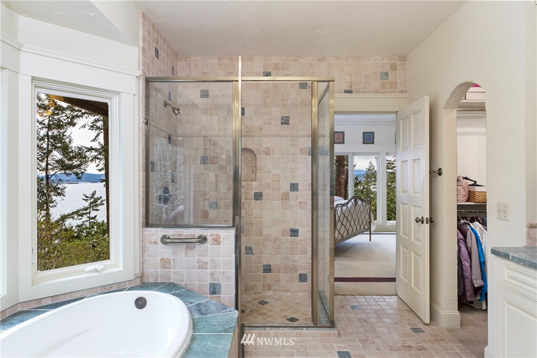 764 Big Foot Road Friday Harbor, WA 98250 - Photo 16 of 34 a bathroom with a shower a sink and a mirror