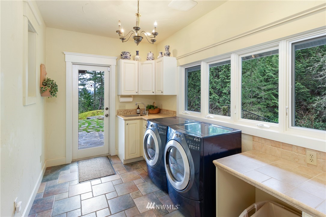 764 Big Foot Road Friday Harbor, WA 98250 - Photo 18 of 34 a utility room with dryer and washer
