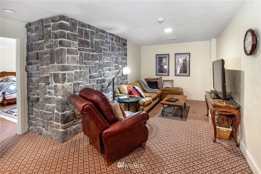 764 Big Foot Road Friday Harbor, WA 98250 - Photo 20 of 34 a living room with furniture and a flat screen tv