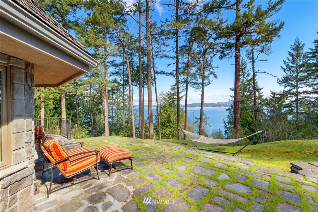 764 Big Foot Road Friday Harbor, WA 98250 - Photo 24 of 34 a backyard of a house with table and chairs