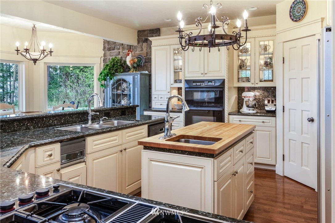 764 Big Foot Road Friday Harbor, WA 98250 - Photo 8 of 34 a kitchen that has a lot of cabinets in it