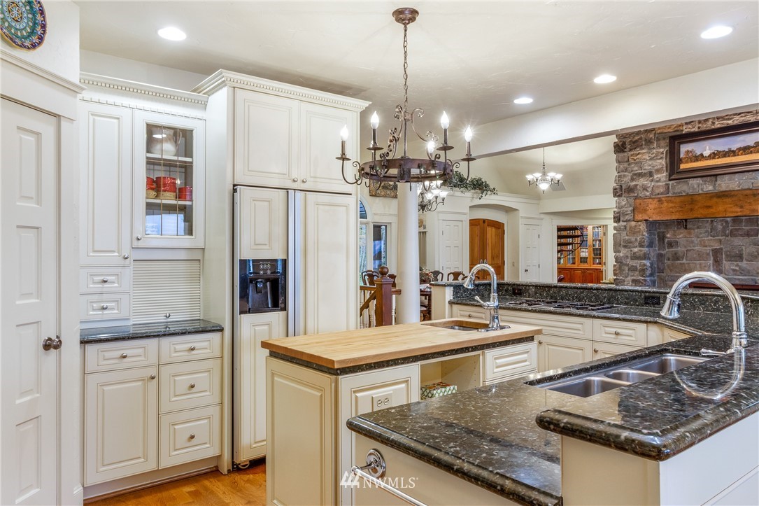 764 Big Foot Road Friday Harbor, WA 98250 - Photo 9 of 34 a kitchen with stainless steel appliances granite countertop a sink stove and refrigerator