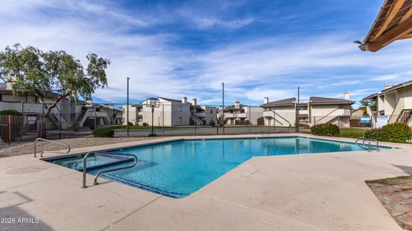 a view of a swimming pool with a lounge chairs